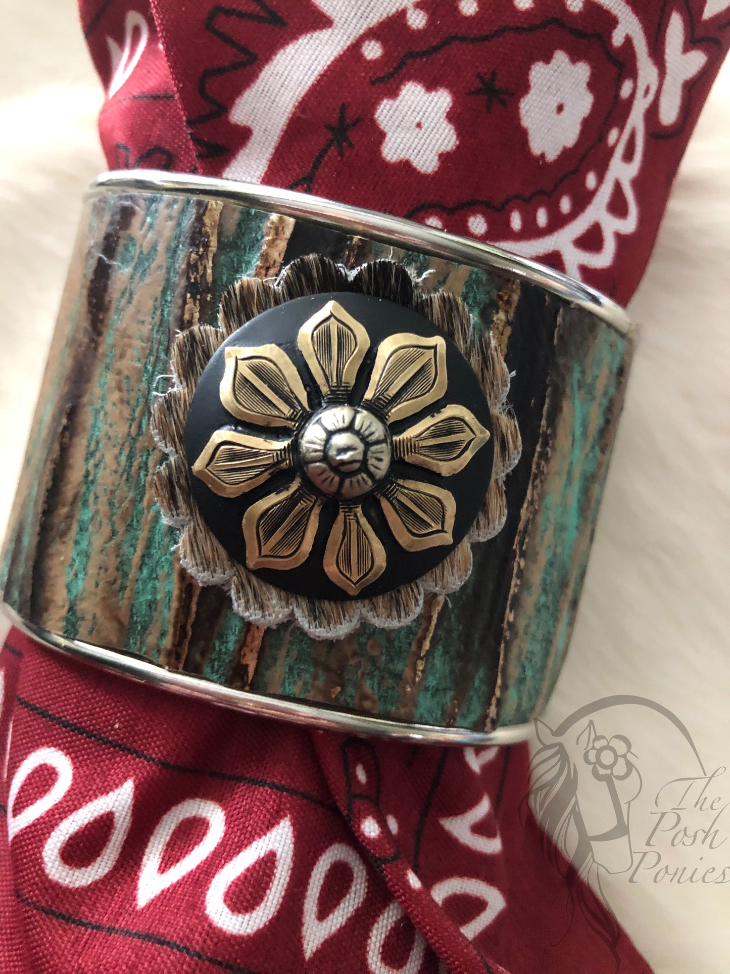Cuff metal with turquoise textured leather print with handmade brass sunflower center concho