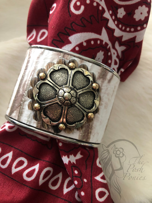 Cuff metal leather overlay 2" with gold tones and handmade concho centerpiece